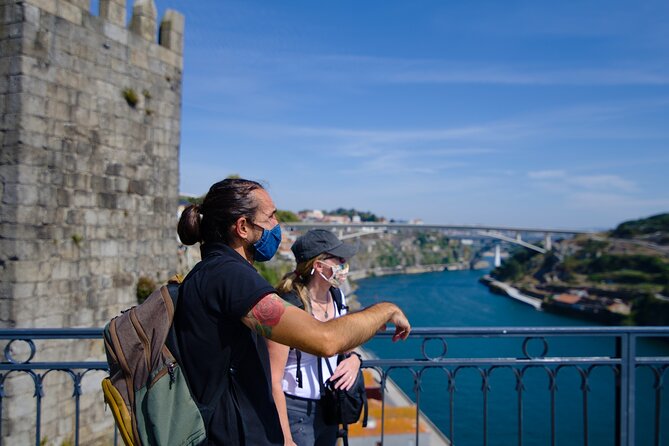 Discover Porto A Private Walking Tour with Authentic Tasting - Crossing Ponte Luiz I for the big Porto view