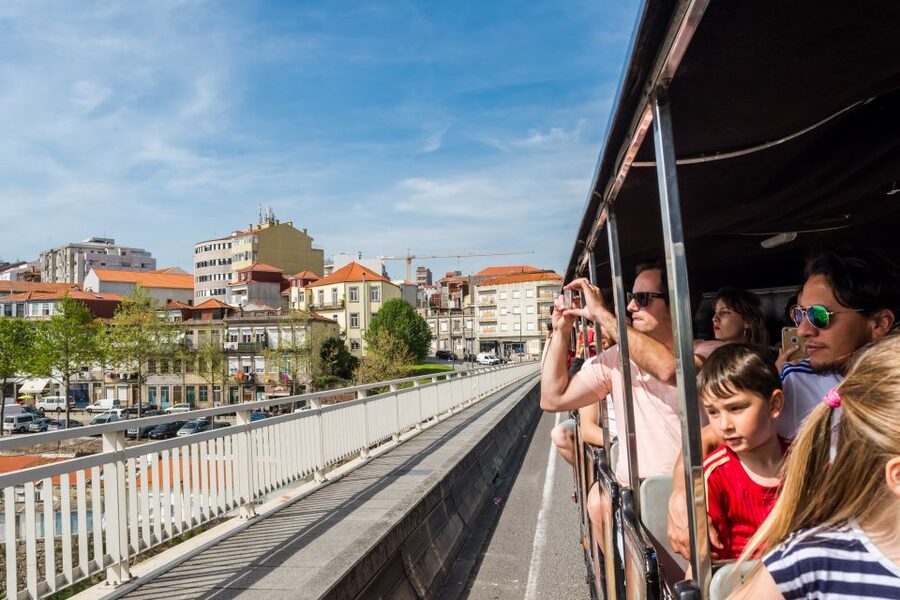 Porto: City Train Tour, River Cruise & Wine Cellar - Riding Porto’s steep central streets