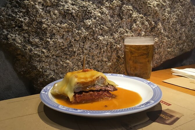 Porto Food Tour of 8 Tastings: Custard Tart, Bifana & Hidden Gems - The savory heart of the menu: bifana and codfish cake