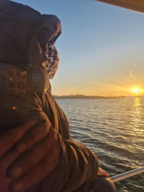 Porto: Guide Boat tour with tasting of 4 Port wines - Sunset and the open river near Foz do Douro