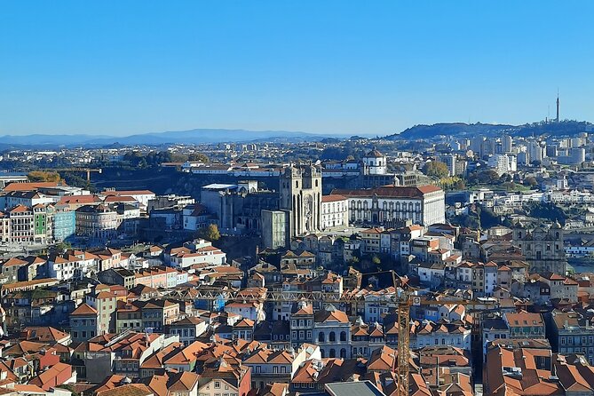 Porto Heritage Night Tour With Fado Show And Dinner Included - Praça da Ribeira and the dinner setting