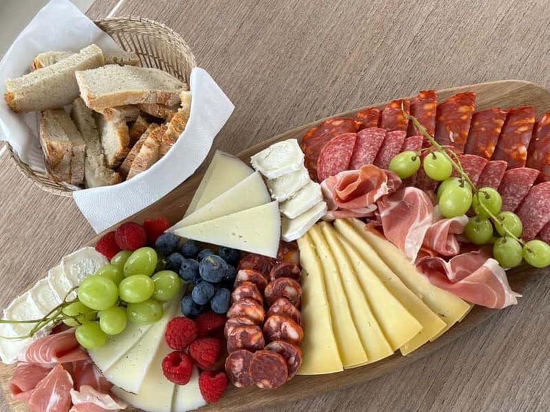 Porto: Private Yacht Cruise with Local Wines & Snacks - Ribeira and the Port cellars from the water