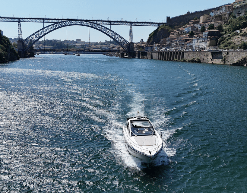 Porto: Private Yacht Cruise with Local Wines & Snacks - Continuing west to Arrábida Bridge