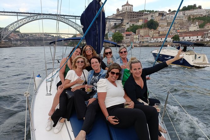 Porto: Single Party on a charming sailboat with welcome drink - Seeing Porto from beneath the Luiz I Bridge