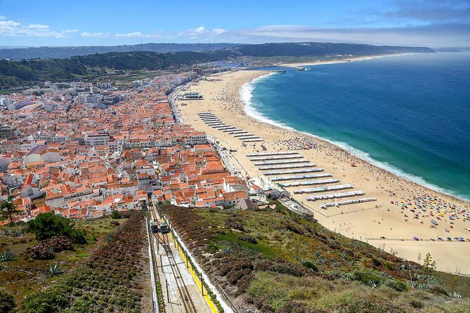 Porto to Lisbon with stop Aveiro-Fátima-Coimbra-Tomar-Nazaré-Óbidos - Nazaré combines beach, cliffs, and famous waves