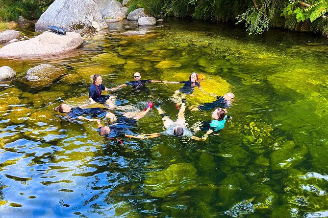 River Trekking/soft canyoning through wild lagoons and Waterfalls - Walking into the river near Braga