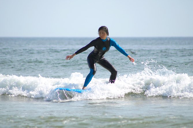 Small Group Surf Coaching in Porto with photos - Getting fitted with a board and wetsuit